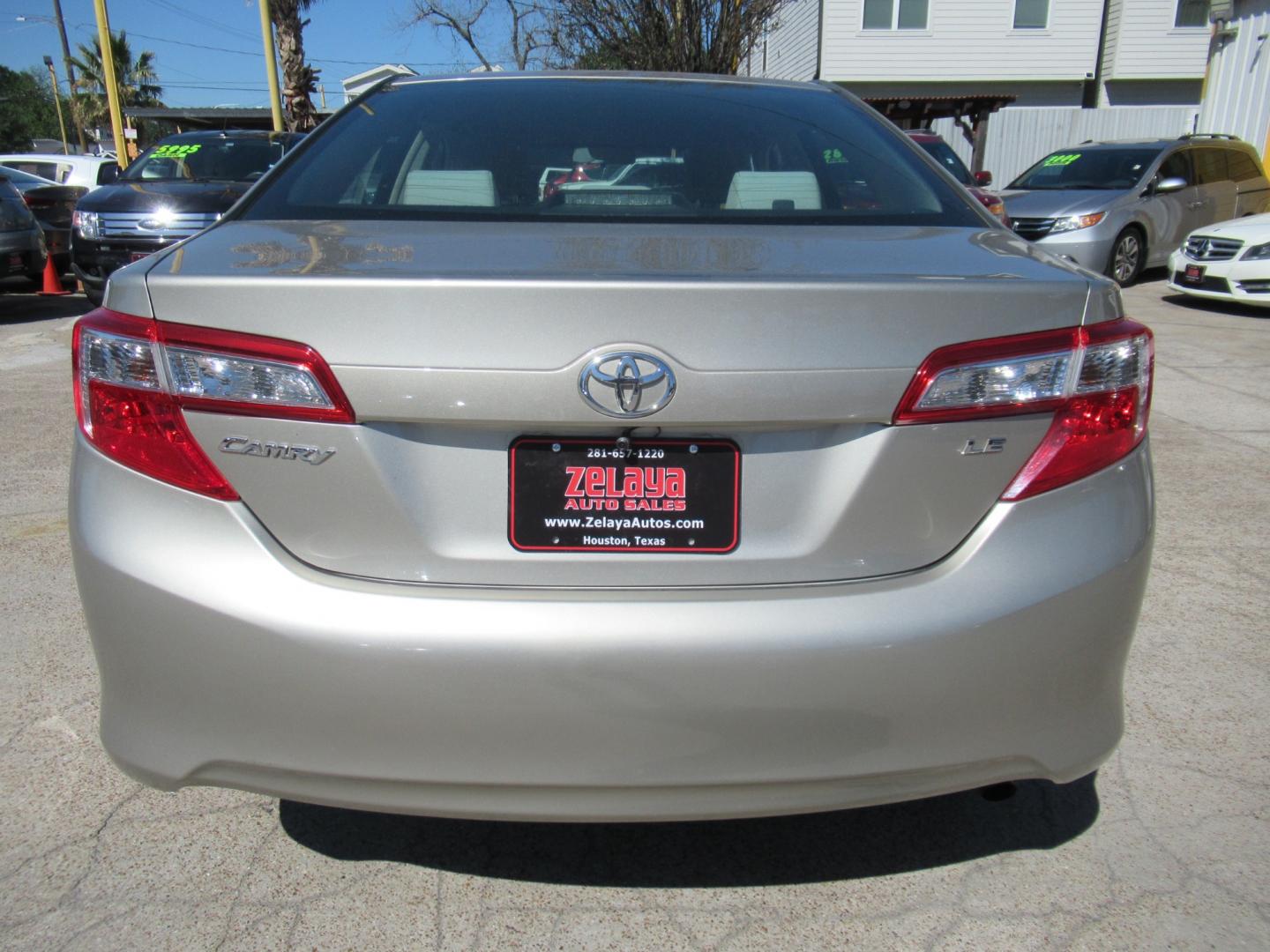 2014 /Tan Toyota Camry L (4T4BF1FK2ER) with an 2.5L L4 DOHC 16V engine, Automatic transmission, located at 1511 North Shepherd Dr., Houston, TX, 77008, (281) 657-1221, 29.798361, -95.412560 - 2014 TOYOTA CAMRY LE VIN: 4T4BF1FK2ER364962 4 T 4 B F 1 F K 2 E R 3 6 4 9 6 2 SEDAN 4 DR 2.5L I4 F DOHC 16V GASOLINE FRONT WHEEL DRIVE - Photo#16